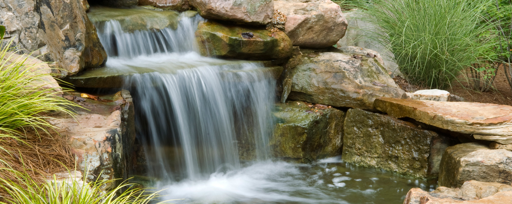 Waterfall and pond landscaping by Wold Landscaping