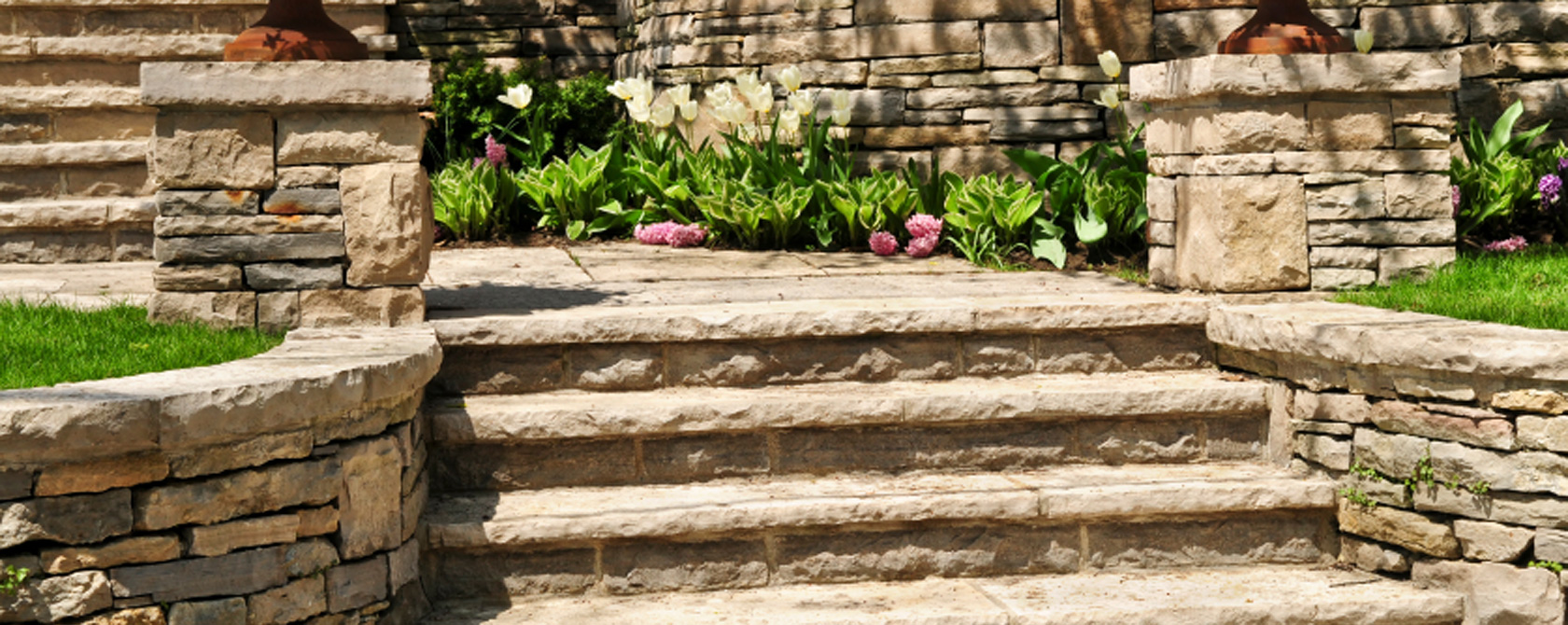 Paver walkway and retaining walls by Wolf Landscaping