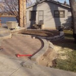 Laying out border (soldier course) for sidewalk - Wolf Landscaping