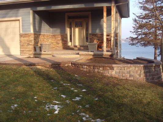 Retaining wall and paver sidewalk completed - Wolf Landscaping