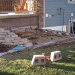 Installing retaining wall with Anchor Highland block - Wolf Landscaping