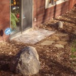 Paver pad and outcroppings by Wolf Landscaping