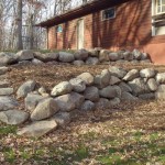 Boulder walls and steps completed by Wolf Landscaping