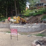 Kitchen walls complete and pavers being installed by Wolf Landscaping